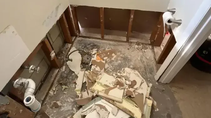 Bathroom taken down to bare studs after a sewage backup was cleaned up