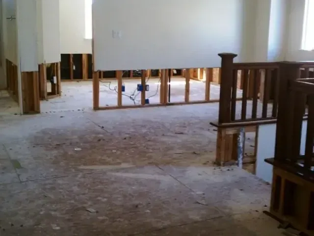 Rooms opened up with the lower drywall cut away so the wall cavities can dry